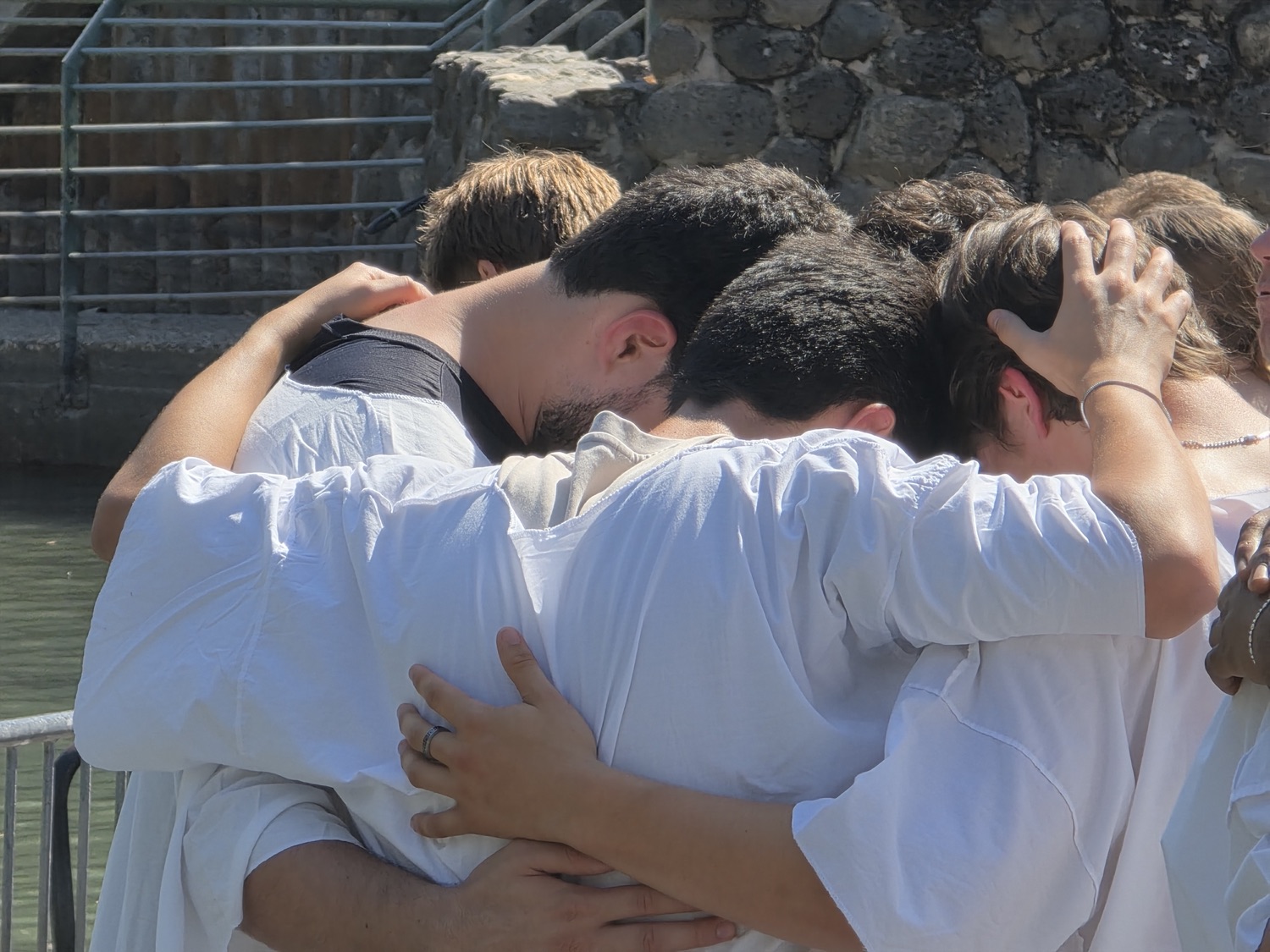 The group holding one another